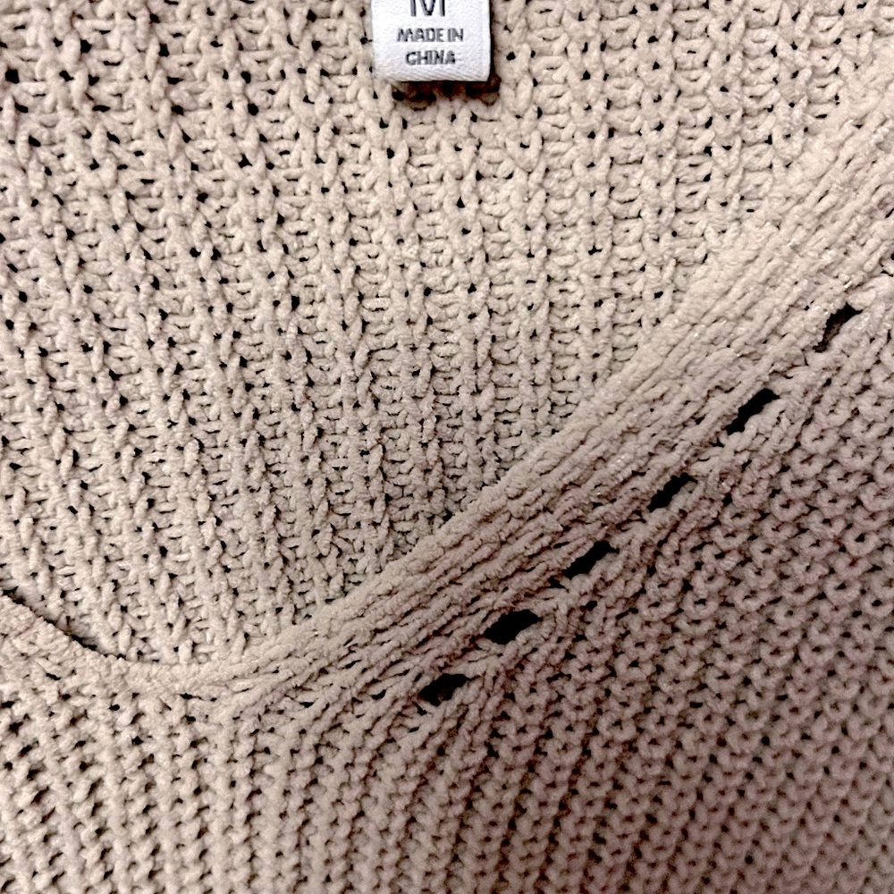 Beige v neck sweater.